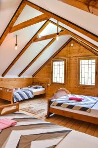 a room with two beds in a attic at Chalet Mediterraneo in Ulcinj
