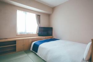 Letto o letti in una camera di Hamilton Hotel Blue