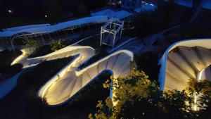 an overhead view of a slide at night at So Good Haad Rin Resort in Haad Rin