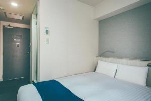 Letto o letti in una camera di Hamilton Hotel Blue