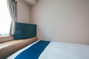Letto o letti in una camera di Hamilton Hotel Blue