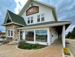 a large white building with a sign on it at 201 -Single Queen in Waunakee