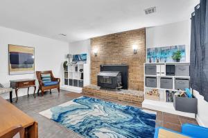 a living room with a fireplace and a brick wall at Private Single Family Home Close to Both Water and Downtown! in Annapolis