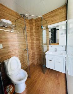 a bathroom with a toilet and a shower and a sink at Mina Thien Ha in Da Lat +27 photos