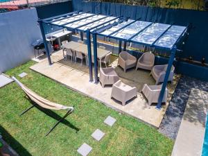 an overhead view of a patio with a table and chairs at La Coqueta in Herradura