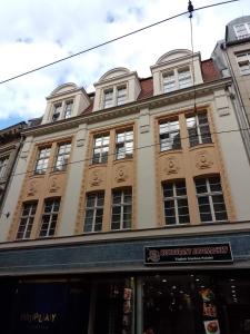 a large building with many windows on a street at Piano Apartment in Halle Center - Netflix - Free WiFi 1 in Halle an der Saale