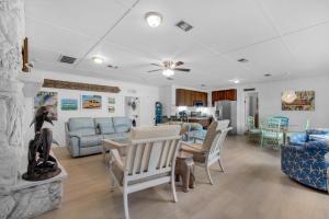 a living room with a couch and a table at Bungalow By the Sea-Mermaid in Navarre