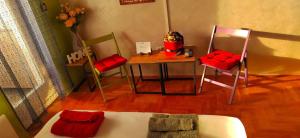a room with a table and two chairs and a table and a table at Ping in Lukavica +41 photos