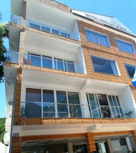 a facade of a hotel with a sign on it at Hotel Shivaay in Dharamshala