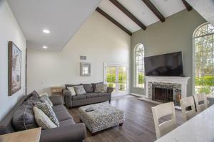 a living room with a couch and a fireplace at Casa Rosé in Temecula