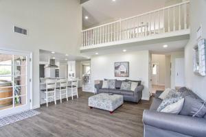 a living room with a couch and a kitchen at Casa Rosé in Temecula