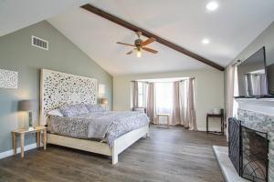 a bedroom with a bed and a ceiling fan at Casa Rosé in Temecula +42 photos