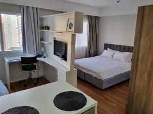 Ένα ή περισσότερα κρεβάτια σε δωμάτιο στο Alphaville Stadium Residence +33 φωτογραφίες