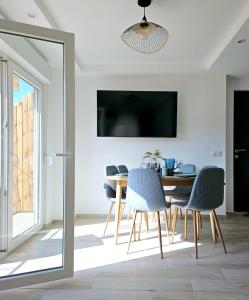 a dining room with a table and chairs at MIRADOR HOLIDAY HOME in Santa Pola