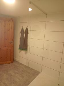 a room with a glass shower with a door at Stübchen in Nonnweiler
