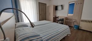 Postel nebo postele na pokoji v ubytování Hotel Splendor
