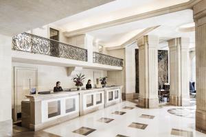 a lobby of a hotel with two people sitting at a salon at Majestic Hotel & Spa Barcelona GL in Barcelona