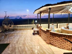 Kép Private Oasis Panoramic Pyramids View RelaxJacuzzi szállásáról ‘Ezbet `Abd el-Ḥamîd városában a galériában