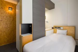 Кровать или кровати в номере Hotel Oak Shizuoka