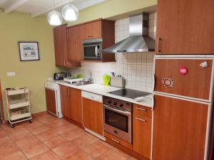 Η κουζίνα ή μικρή κουζίνα στο Casa Maitri- con piraguas junto a la ría +20 φωτογραφίες