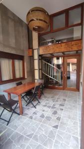 a dining room with a wooden table and chairs at vivienda turística los Robles in Tudela