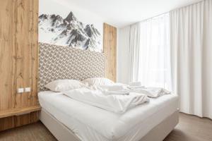 Łóżko lub łóżka w pokoju w obiekcie Alpenrock Schladming by ALPS RESORTS