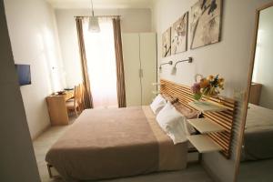 Un pat sau paturi într-o cameră la Villa Gina