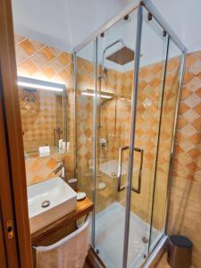 a bathroom with a shower and a sink at A casa di Chiara Salerno in Salerno