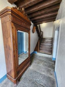 a room with a wooden door and a staircase at Magnifique Cottage à Lescun in Lescun