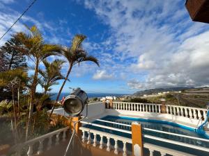 a camera on a balcony with a view of the ocean at Atlantic views in Tacoronte