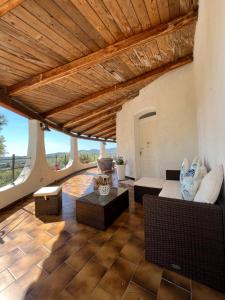 a living room with a couch and a table at Casa Le Cicale in Porto Istana