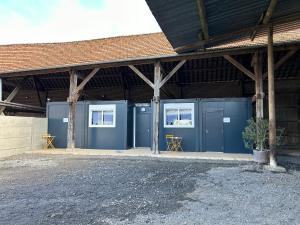a group of blue storage containers in a building at Les Chambres de Campagne in Campagne