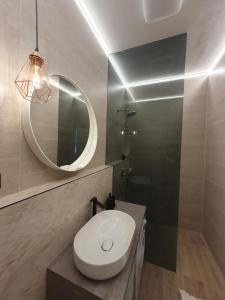 a bathroom with a toilet and a mirror at Accommodation Iva in Zadar