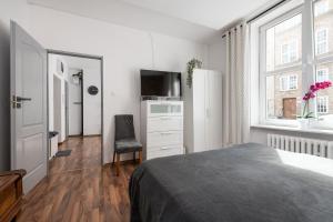 Posteľ alebo postele v izbe v ubytovaní Piano Apartment w sercu Starego Miasta