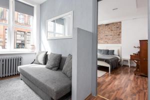 Posteľ alebo postele v izbe v ubytovaní Piano Apartment w sercu Starego Miasta