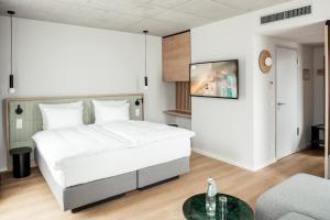 Postel nebo postele na pokoji v ubytování Coreum Hotel + 34 fotografií