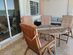 a table and chairs in a room with a couch at 4 bed house, Private Pool near Beach in Burriana