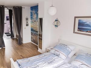 Postel nebo postele na pokoji v ubytování Unsere-Insel-Scharbeutz