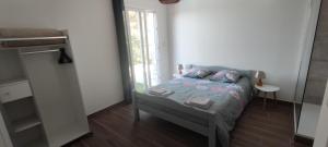 Postel nebo postele na pokoji v ubytování F4 à Porticcio avec piscine et vue sur mer + 22 fotografií