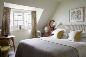 a bedroom with a large bed and a window at Hotel Tresanton in Saint Mawes