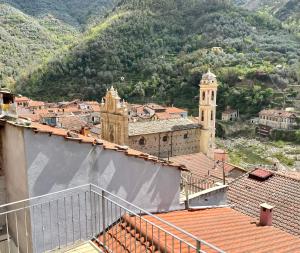 a view of a town with a clock tower at Casa Via Vezzargo in Badalucco