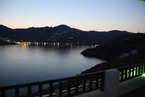 a view of a large body of water at dusk at Astrio Suites in Livadi