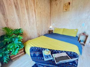 Postel nebo postele na pokoji v ubytování The Burrow Dalat