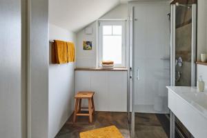 a bathroom with a shower and a sink at Biopension Satya in Offenburg