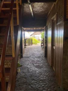 ein leerer Flur eines Hauses mit einer Treppe in der Unterkunft Auntie Mina's Beach Cabins in Puerto Princesa
