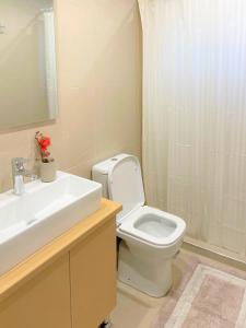 a bathroom with a toilet and a sink and a shower at Lefkada house with private yard parking 2 in Nydri +7 photos