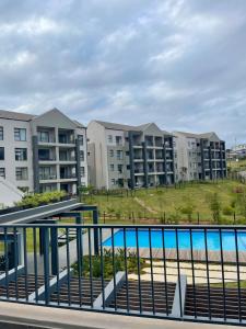 a view of an apartment complex with a pool at 151 Ballito Luxury Villa in Ballito