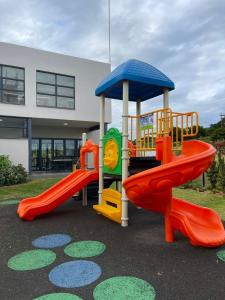 a playground with a slide and a slideintend at 151 Ballito Luxury Villa in Ballito