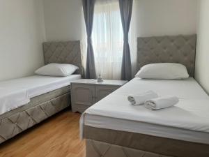 Postel nebo postele na pokoji v ubytování Apartments Medic