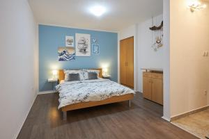 Postel nebo postele na pokoji v ubytování Apartment Blue